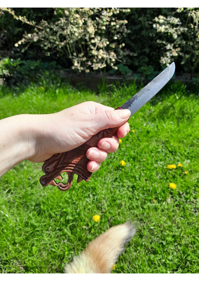 Functional Norse knife with hand-carved Dragon handle and leather sheath.