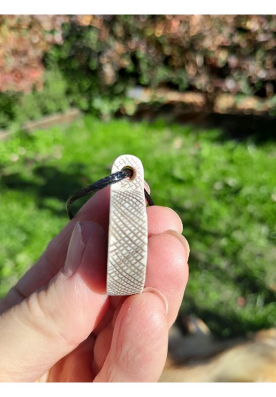 Hand-carved pendant with Ægishjálmr symbol. Helm of Awe amulet.