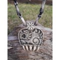 Hand-carved Wolf paw amulet – helm of awe & algiz rune