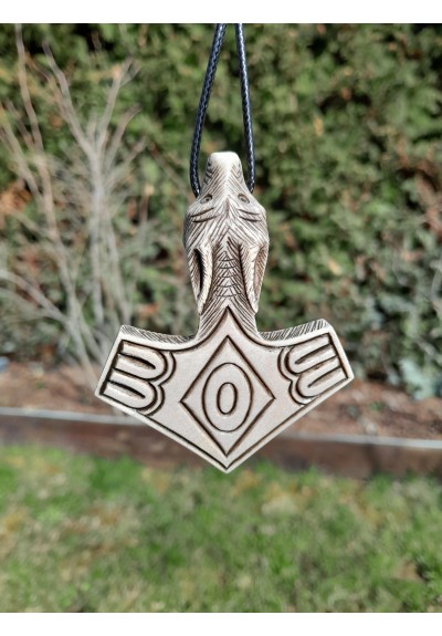 Hand-carved Mjolnir amulet with Wolf head. Hand-carved Mjolnir amulet with Wolf head.