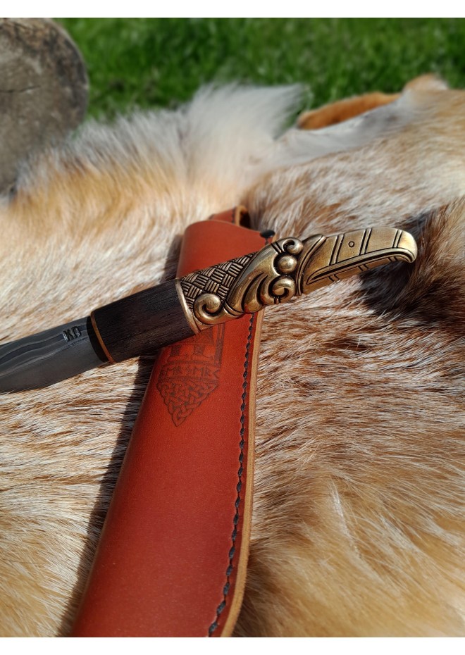Handcrafted Norse knife. Damascus steel & Raven handle.