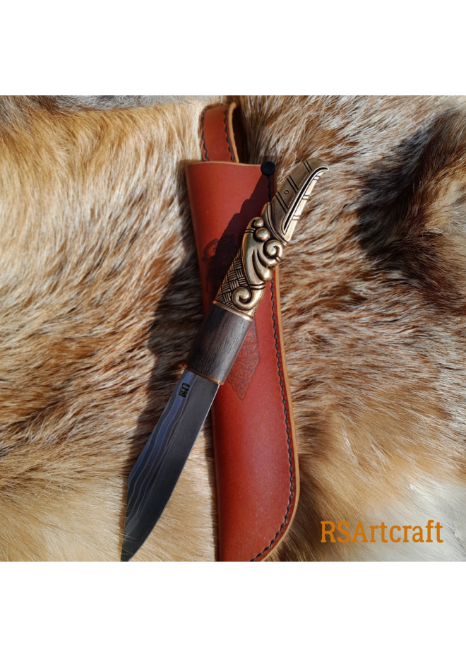 Handcrafted Norse knife. Damascus steel & Raven handle.