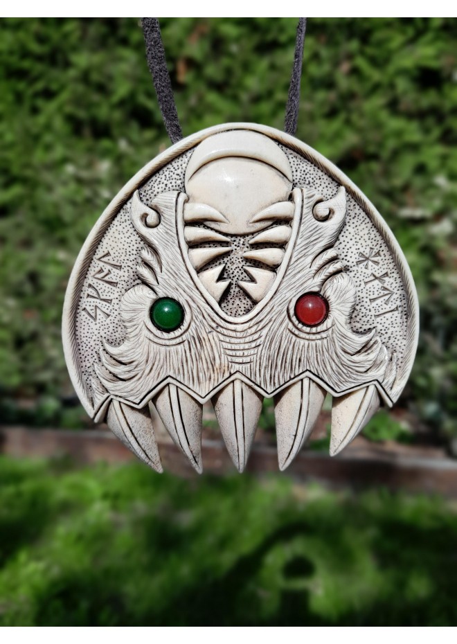 Double Wolf head with green and red eye. Carved Odin’s face