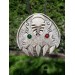 Double Wolf head with green and red eye. Carved Odin’s face