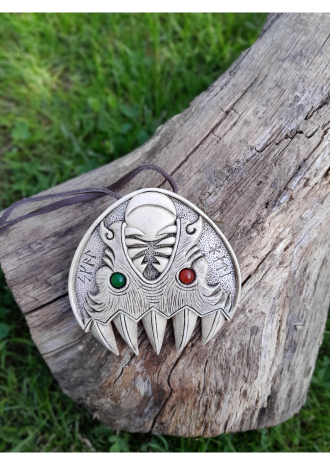 Double Wolf head with green and red eye. Carved Odin’s face