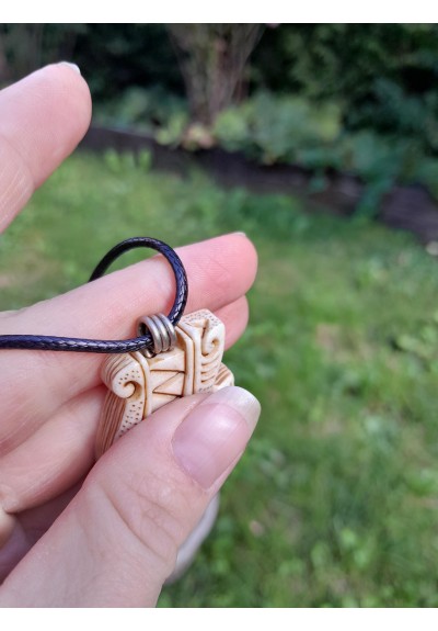 Hand-carved Viking Wolf amulet from moose antler and buffalo horn with green gemstone eye
