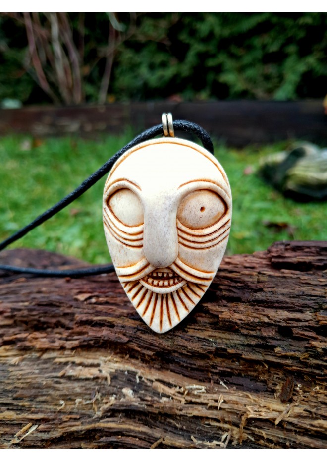 Handcrafted moose antler amulet featuring Odin and runes