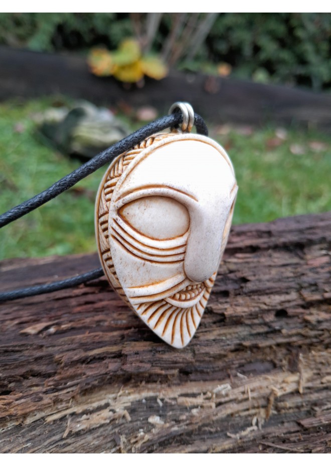 Handcrafted moose antler amulet featuring Odin and runes
