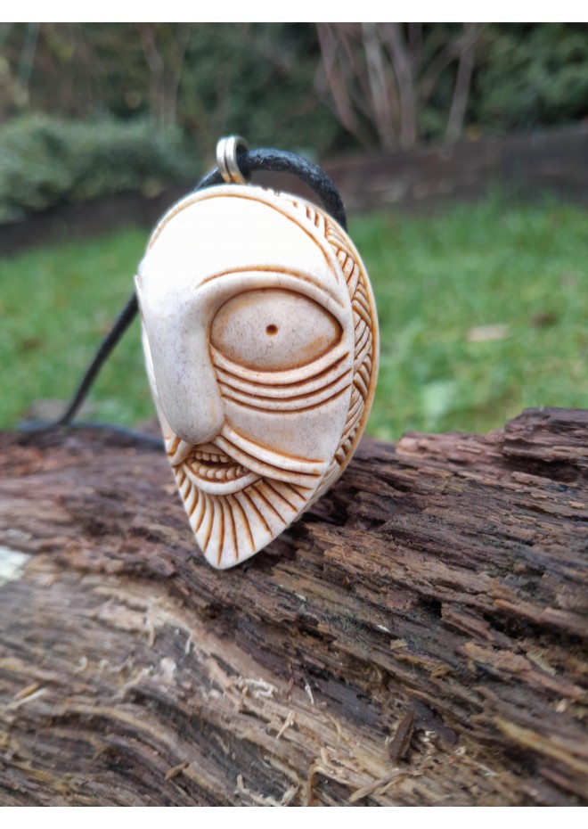 Handcrafted moose antler amulet featuring Odin and runes