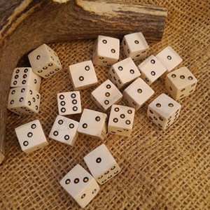 Hand-carved bone dice Hand-carved bone dice