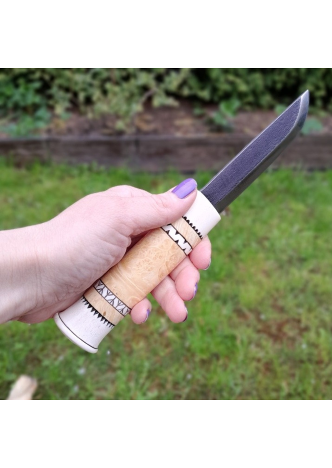 Handmade Puukko knife. Traditional Finnish craftsmanship.
