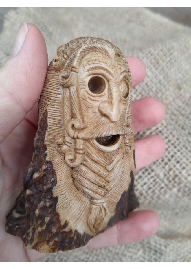 Old Norse God. Odin statue. Moose antlers hand-carved