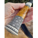 Handmade Finnish Puukko knife with master engraving and leather sheath. Hand-forged blade. Antler and stabilized maple burl handle.